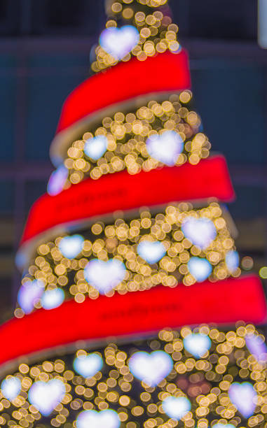 istock Defocused christmas tree lights. Heart shaped bokeh 504122806