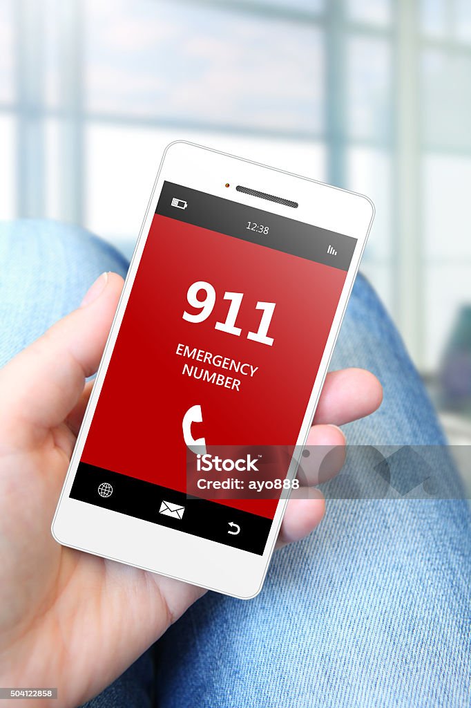 hand holding mobile phone with emergency number 911 hand holding mobile phone with emergency number 911. focus on phone. Emergency Services Occupation Stock Photo