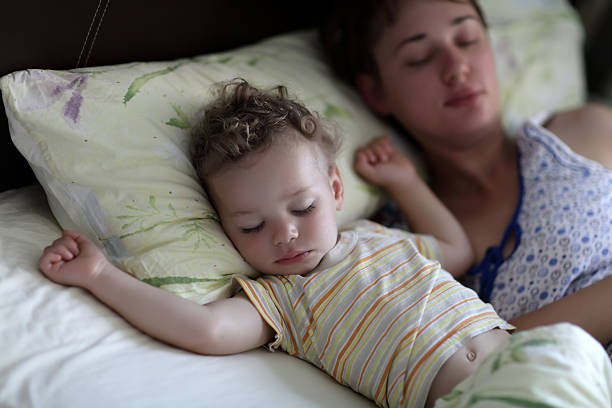 istock Mother with toddler on a bed 504124214
