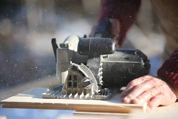 Circular saw cutting wood stock photo