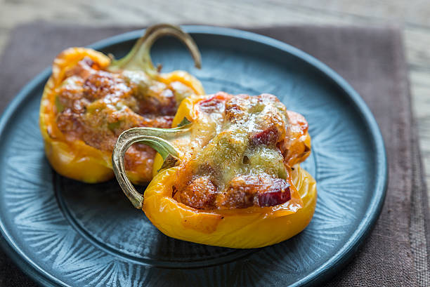 istock Stuffed peppers with sausages and mozzarella topping 504128312
