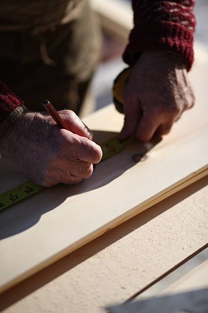 istock Carpenter and Tape Measure 504129588