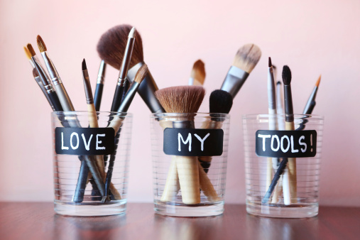Make up brushes in glass jars - love my tools