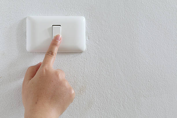 istock closeup finger press turn on/off electric-switch 504130519