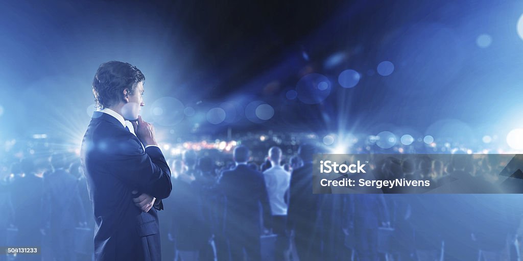 Technology innovations Businessman in suit against digital background with icons Adult Stock Photo