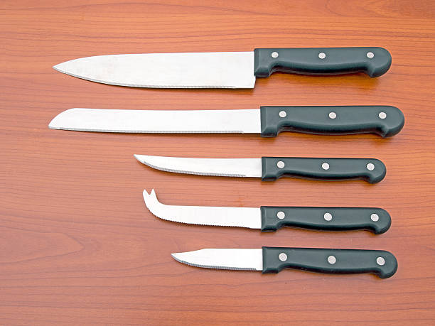 istock Set of kitchen knives on wood work surface 504131468