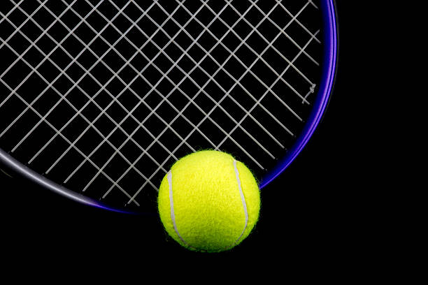 istock Tennis Racquet and Ball on Black Background 504132004
