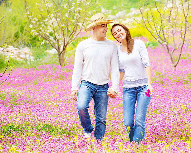 istock Loving couple walking in spring park 504132151