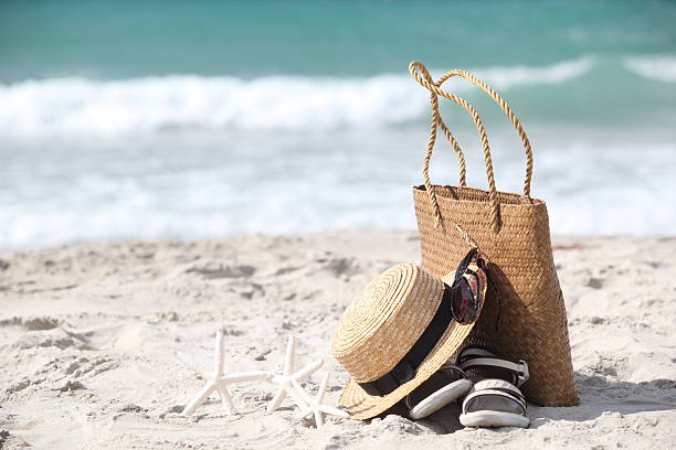 istock Straw hat, bag, sun glasses  on a tropical beach 504132322