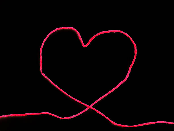 istock rope made of heart shape on black 504132614