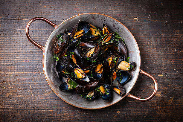 istock Boiled mussels in copper cooking dish 504132621