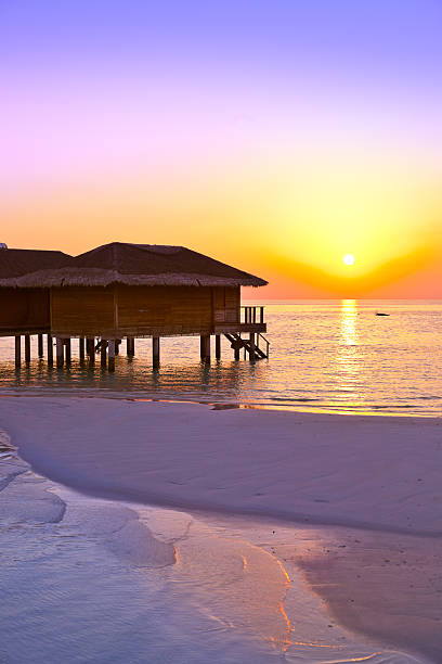 Water bungalows on Maldives island - nature travel background