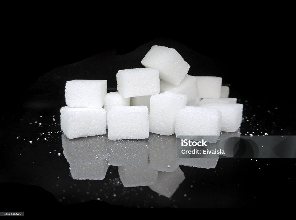Sugar stack Sugar cubes, isolated on black. Sugar Cube Stock Photo