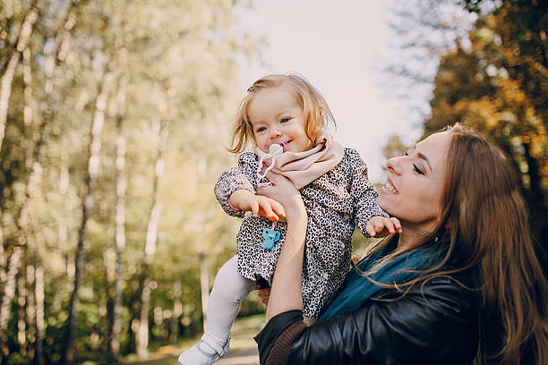 istock young family walking in the park 504134690