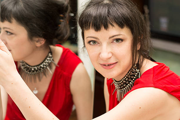 istock young woman in front of the mirror 504135161