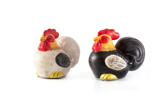 Ceramic hen and rooster isolated on white background