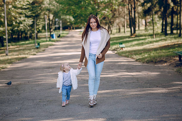 istock young family walking in the park 504135380