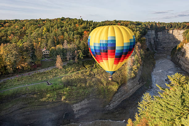Hot Air Balloon At Letchworth State Park Hot Air Balloon Flying Over Letchworth State Park In New York letchworth state park stock pictures, royalty-free photos & images