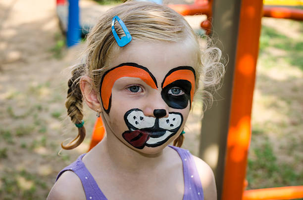 istock girl with face painting 504135933