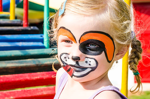istock girl with face painting 504135935