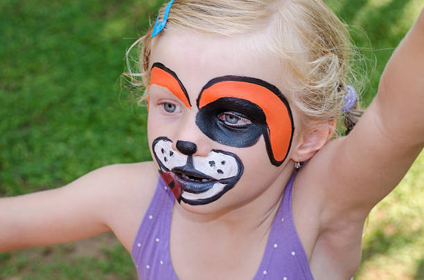 istock girl with face painting 504135943