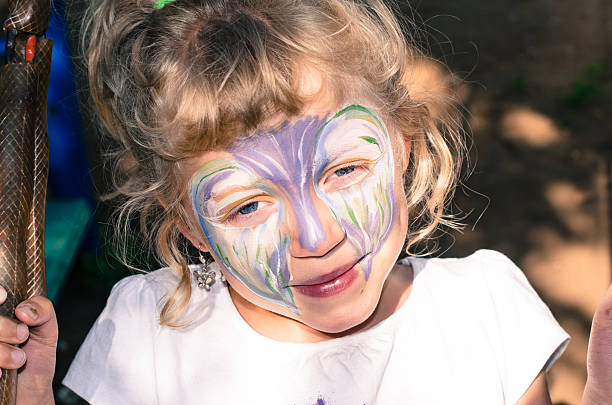 istock girl with face painting 504135955