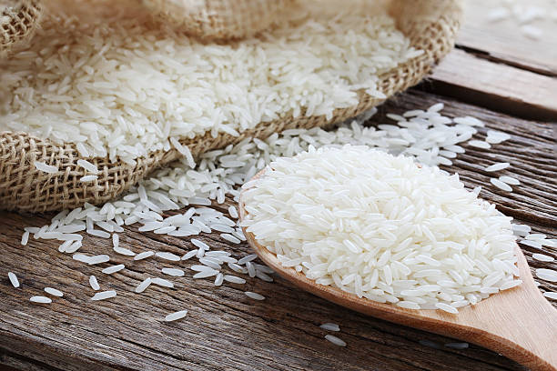 istock closeup jasmine rice on wooden ladle 504136067