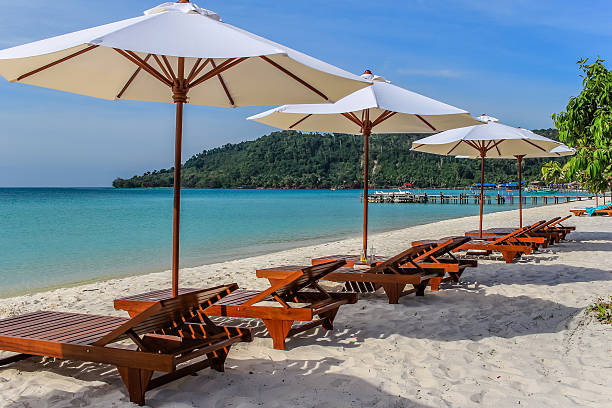 istock Sunbeds on a white sand beach, with turquoise sea. 504178972