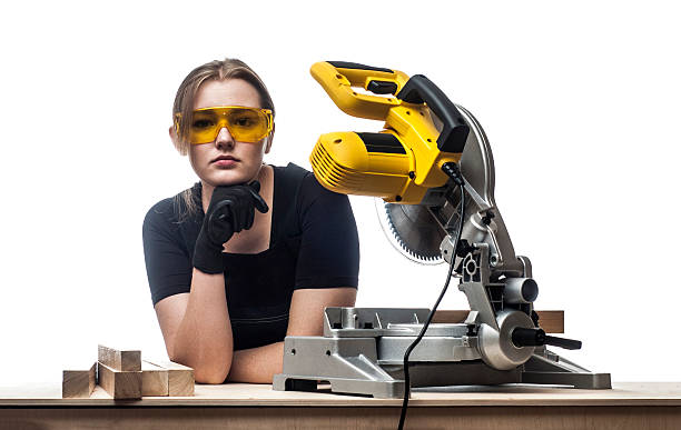 istock woman with a circular disk saw 504179050