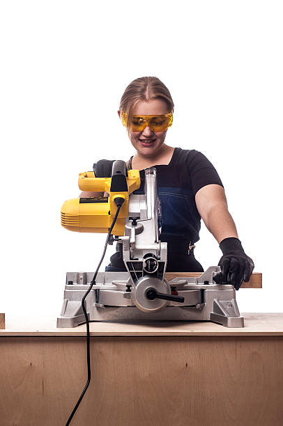istock woman with a circular disk saw 504179146