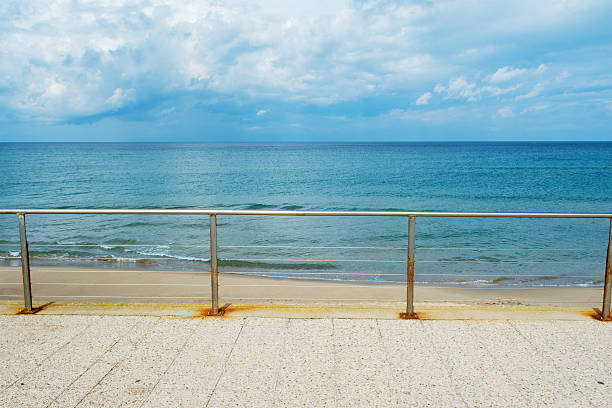istock metal railing by the shore in Sardinia 504180010