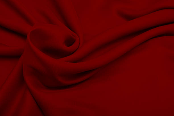 istock Shiny elegant red satin silk fabric background 504180158