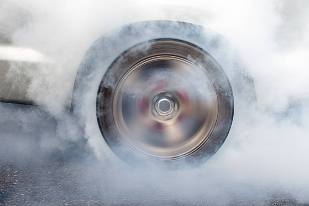 istock race car burns rubber off its tires 504180574