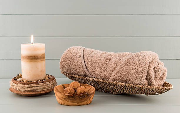 istock Spa Towel with Bath Bombs and Lit Candle 504183730