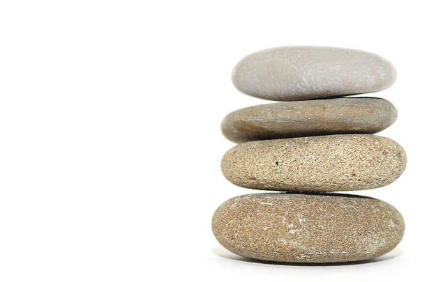 istock Four stacked spa stones on a white background. 504185180