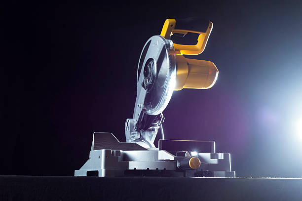 miter saw. Compound miter power saw isolated on a black background. miter saw stock pictures, royalty-free photos & images