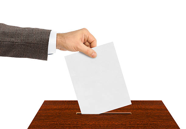 istock Hand with paper ballot 504186194