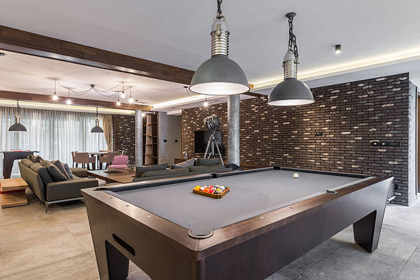 istock Interior of a luxury living room with billiard table 504186252