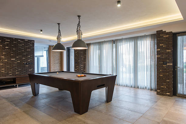 istock Interior of a luxury living room with billiard table 504186384