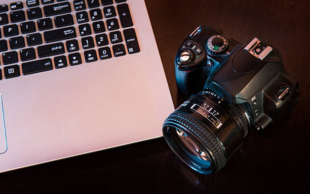 istock DSLR camera and laptop, ready to create amazing photos. 504188554