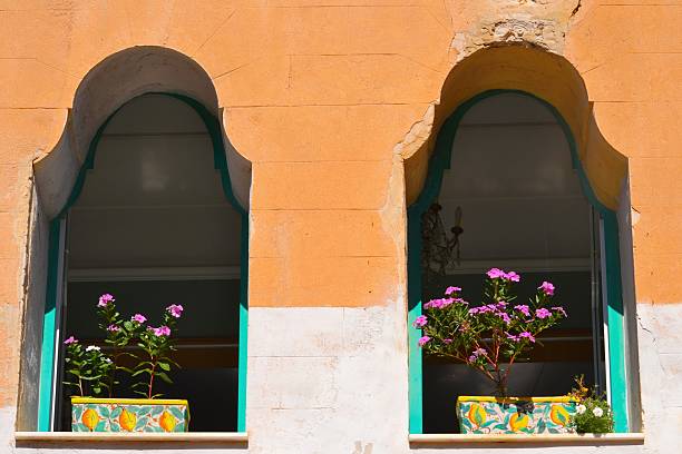 Sicily, Italy. Flowers on the windows