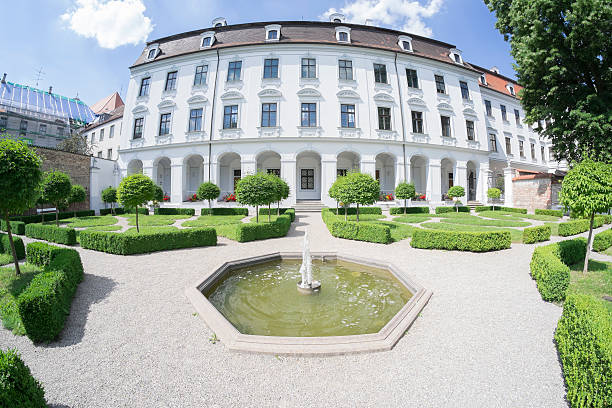 Augsburg, Germany - June 30, 2015: Park and Fountain in the courtyard of Schaezlerpalais of Augsburg. The Augsburger Schaezlerpalais hosts municipal and state art collections, and is located near the Maximilianstrasse in the city center. Augsburg, Bavaria, Germany, Europe