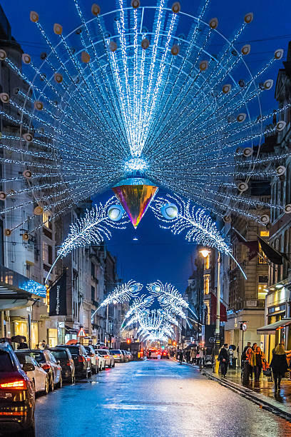 People and traffic move along New Bond Street at Christmas stock photo