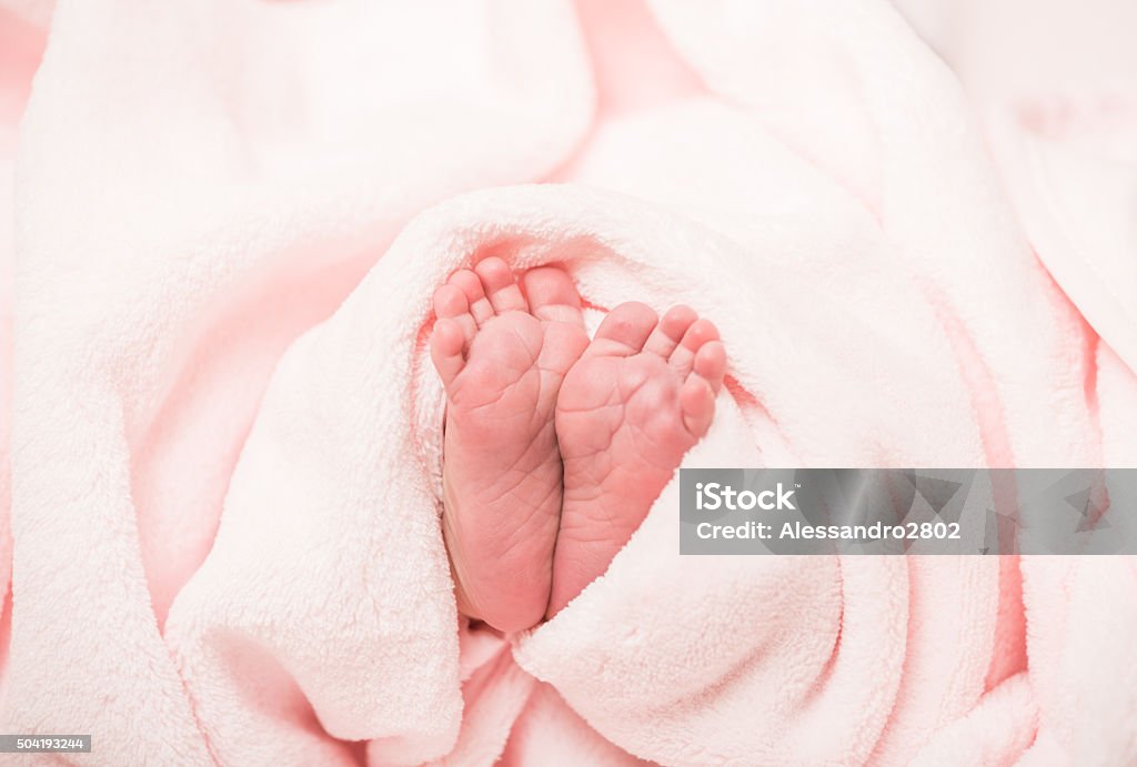 Feet of a newborn Feet of a newborn in pink towel Baby - Human Age Stock Photo