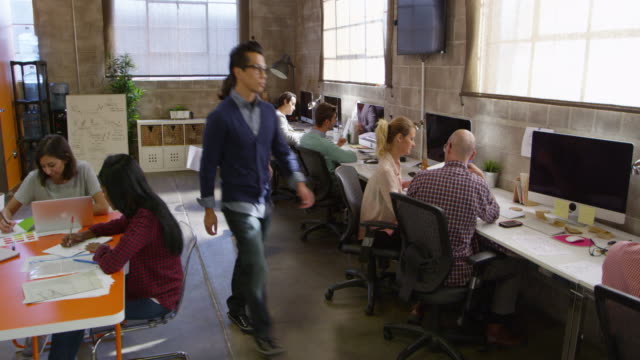 Elevated View Of People Working In Modern Design Office Shot On R3D