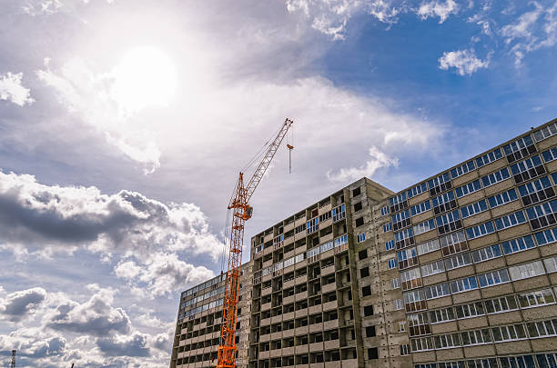 istock Construction of highrise building and industrial cranes 504220528