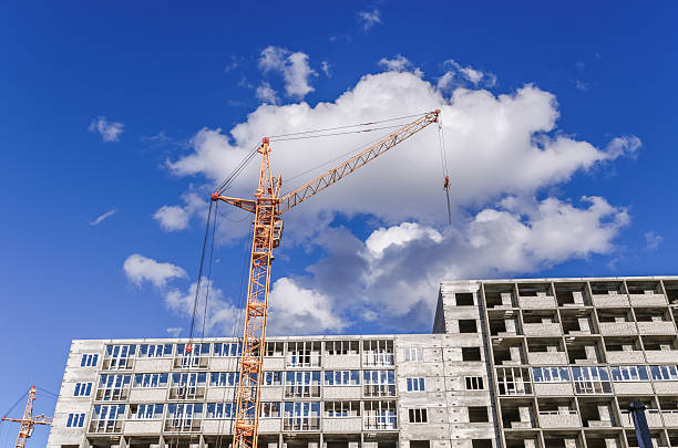 istock New high-rise houses and large crane 504221034