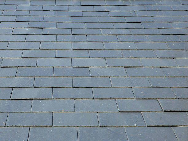 istock Architecture texture - Slate roof tiles full frame background 504222134