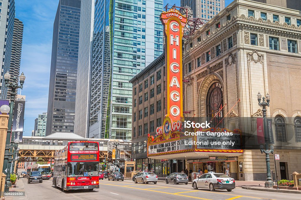 Chicago Theater, USA Chicago, USA - August 22, 2015:  The famous Chicago Marquee Theater Sign on State Street in the loop area of downtown Chcago.   The Chicago Theater is an historic place and is listed as a Chicago Landmark. The rush hour traffic passes in front of the Theater Chicago Theater Stock Photo