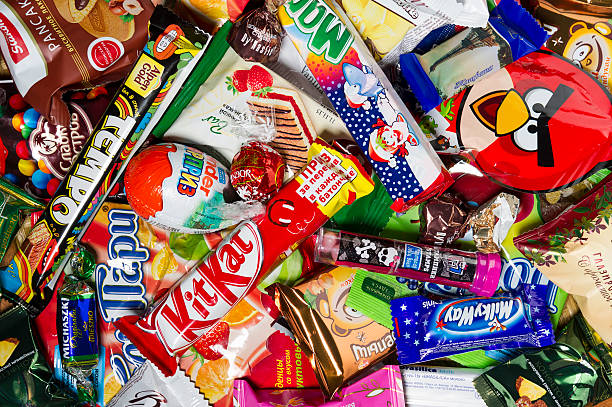 Candies, chocolates, sweets Moscow, Russia - January 02, 2016: Kinder Surprise, Angry Birds, Lindor, Kit Kat, Milky Way, Tempo, Mambo, Brasilica, Pancake, Michaszki and many other candies, chocolates and sweets for kids manufactured by different companies. Studio shot. eye candy stock pictures, royalty-free photos & images